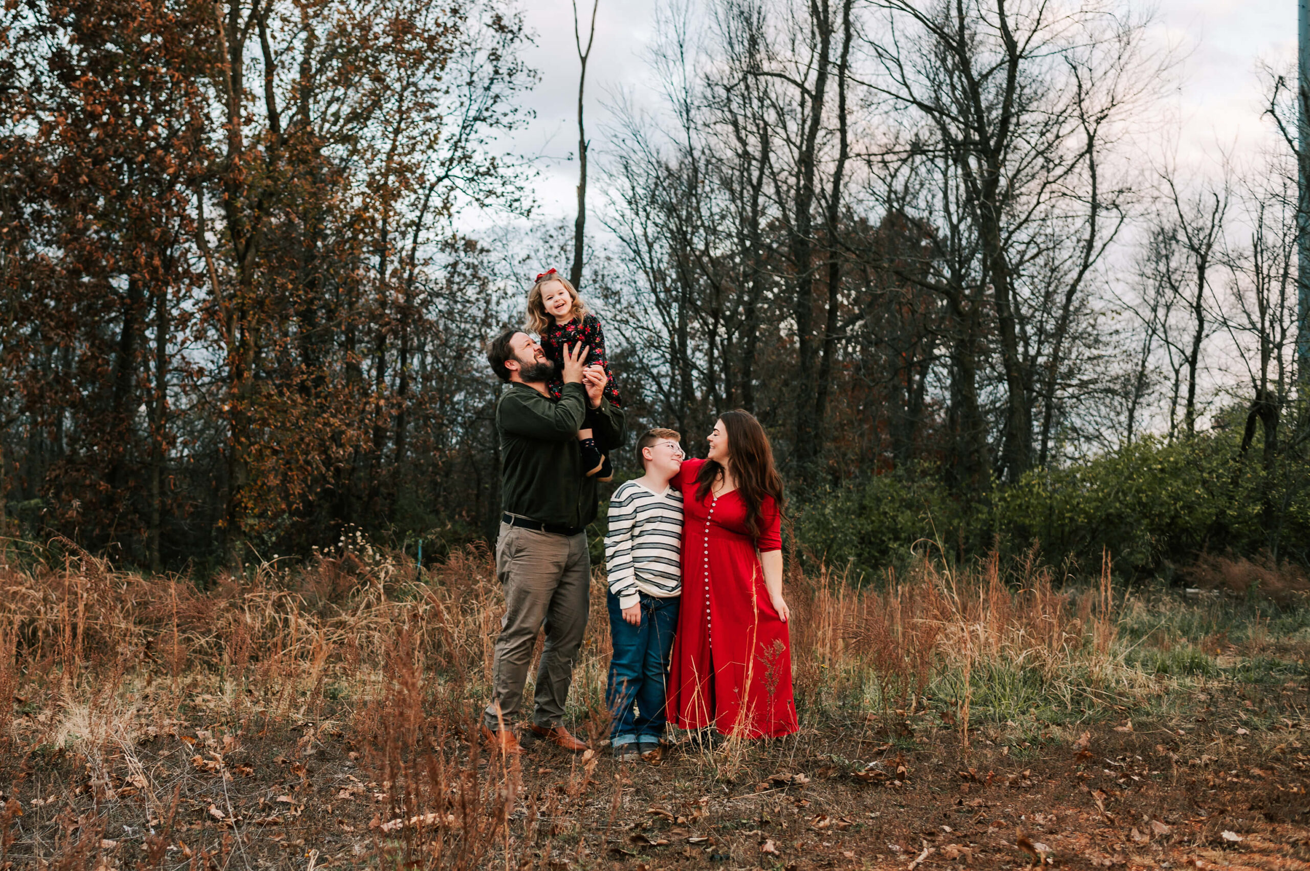 family playing on walking trail during Springfield MO family photographer Jessica Kennedy of The XO Photography