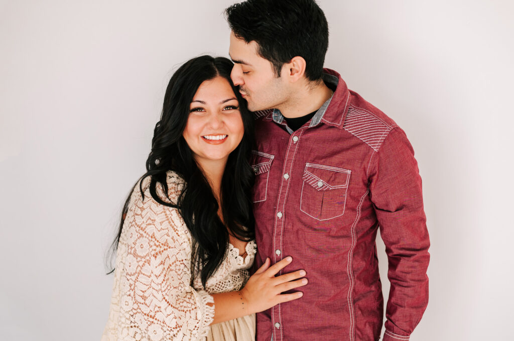  couple cuddling in photography studio in Springfield MO