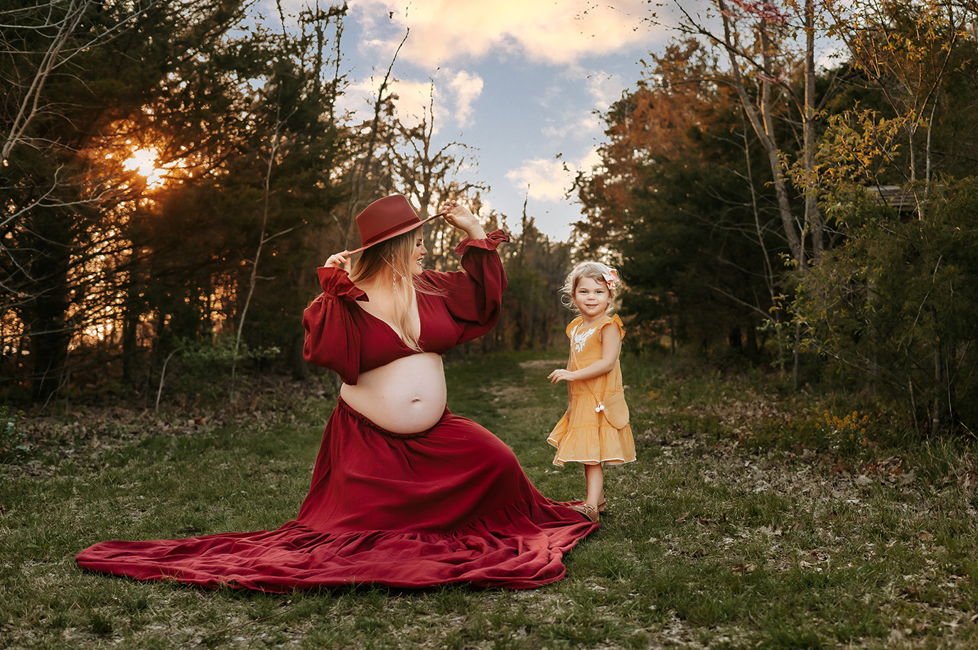 Springfield MO family photographer captures pregnant mom and daughter playing on the way to an indoor playground in Springfield MO