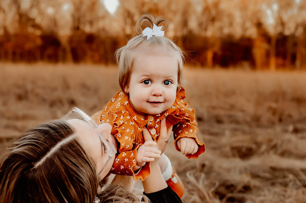 Springfield MO family photographer captures toddler girl smiling after visiting pediatric dentist in Springfield MO