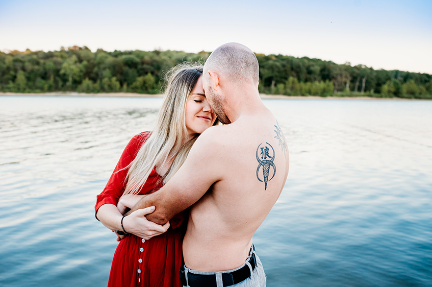 couples photographer in springfield mo in the lake kissing