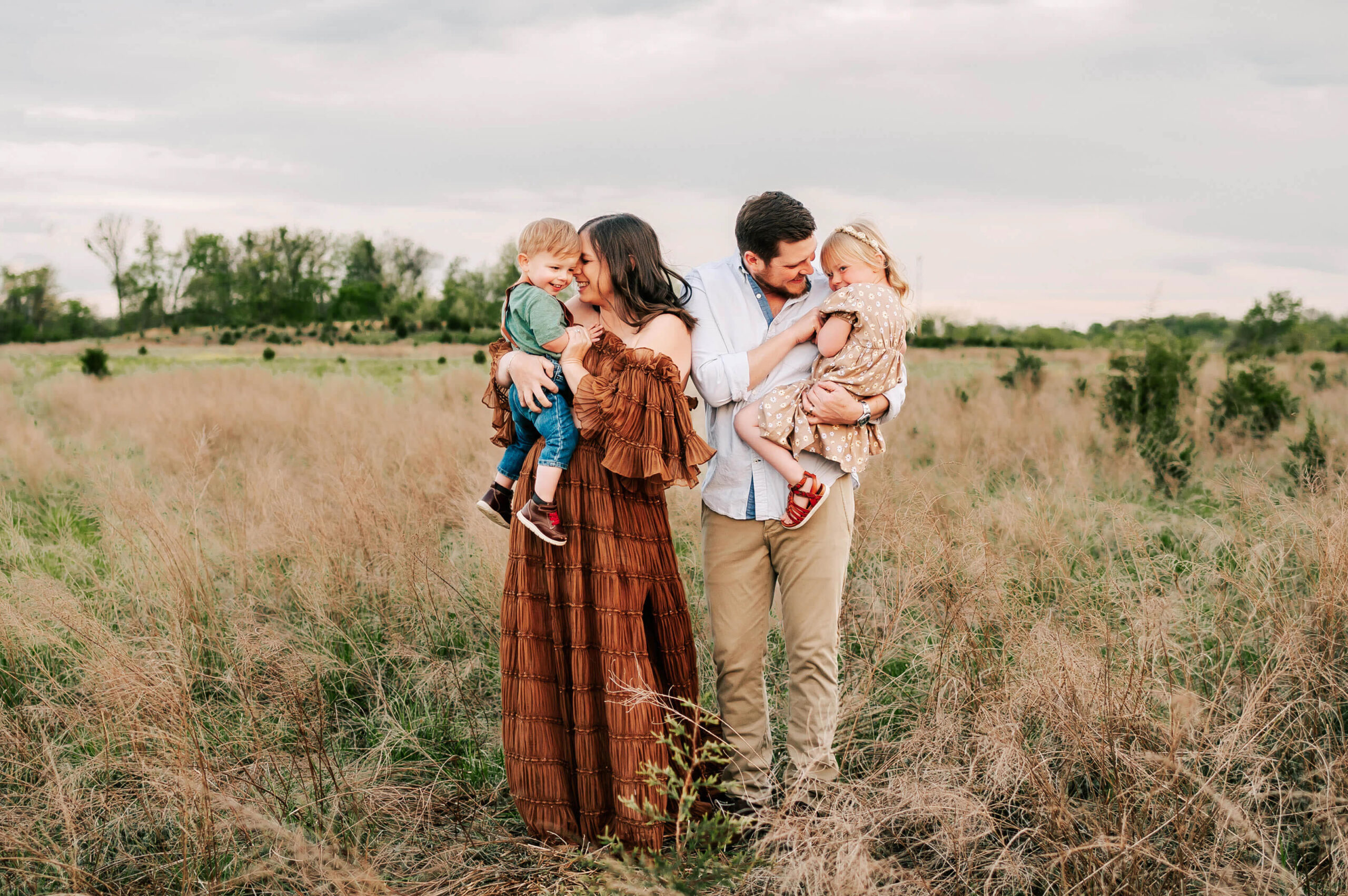 family laughing together captured by family photographer in Branson MO