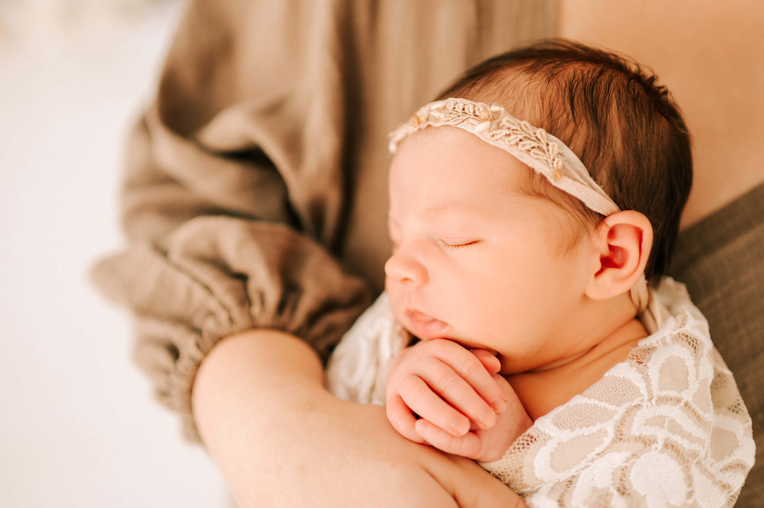 baby girl sleeping in mothers arms captured by Springfield MO maternity photographer Jessica Kennedy of The XO PHotography